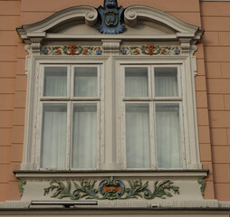 The embroidery at the windows of buildings is a charming touch, adding a touch of grace and beauty to the surroundings with its intricate patterns and delicate stitches.