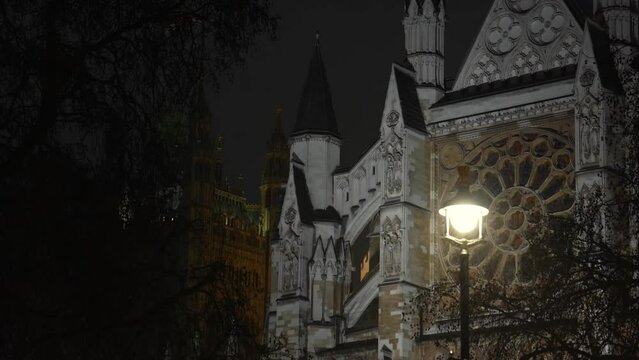 Rainy night in front of Westminster Abbey church, 4k video with this landmark from London.