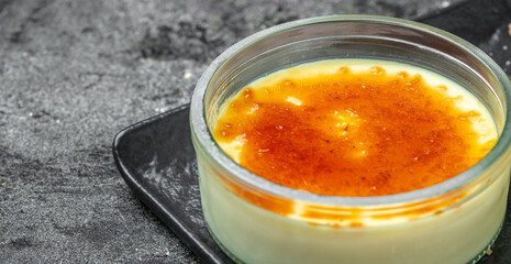 homemade creme brulee with burnt sugar. traditional french vanilla cream dessert. Long banner format. top view