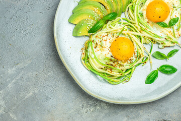 zucchini with eggs and avocado. breakfast. Healthy food, ketogenic diet, diet lunch concept. place for text, top view