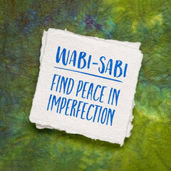 Wabi-sabi Japanese concept, find peace in imperfection, inspirational note on a watercolor paper