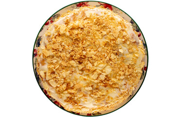 One homemade cream cake on a ceramic dish, macro, top view.