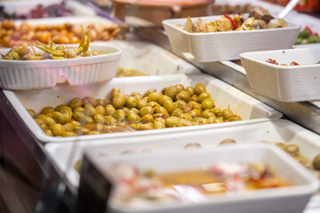 Variety of pickled olives on the market in Barcelona, Spain