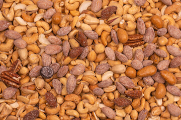 A group of almonds, pistachios, walnuts, macadamia, cashews.