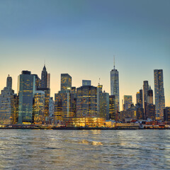 View across East river from Brooklyn to Lower Manhattan at twilight