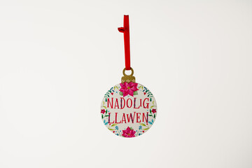 Merry Christmas Nadolig Llawen in welsh language celtic hanging christmas tree decoration isolated...