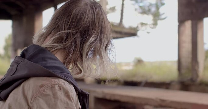 Drunken walk. Poverty is state of being extremely poor. Lack of income, individuals don't have the means to subsist. Head of unrecognizable addicted man, view from back, no face. Long messy hair. 