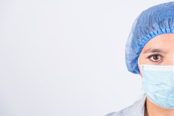 half of a doctor's face, serious, with a cap and mask, doctors investigating an infection.