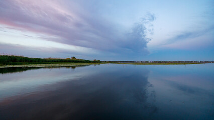 Sunrise with reflections in the Danube Delta in Romania