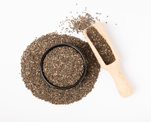 Chia seeds in bowl and wooden spoons isolated on white background.Superfood