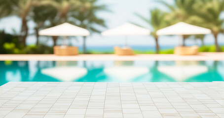 Empty ceramic mosaic table top and blurred swimming pool in tropical resort in summer banner background, for display or montage your products	