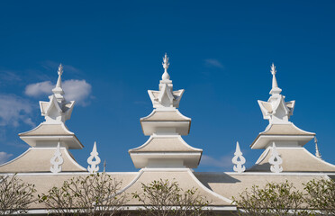 Wat Rong Khun or White Temple complex structures. Temples and detail architectures. It is the most important travel destination in Chiang Rai province. Northern Thailand