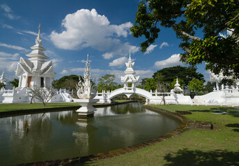 Wat Rong Khun or White Temple complex structures. Temples and detail architectures. It is the most important travel destination in Chiang Rai province. Northern Thailand