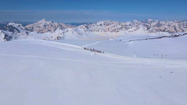 A group of climbers makes an acclimatization hike on Mount Elbrus