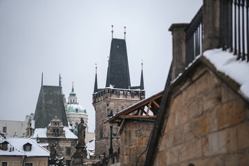 Fototapeta na wymiar Romantic Snowy Prague gothic Castle with the Charles Bridge, Czech Republic