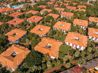 Luxury tropical hotel resort. Outdoor tourism landscape. Luxurious beach resort with bungalows in the park by the beach.