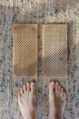 sadhu board, harmony and meditation. energy, metal needles for feet, concentration and yoga at home. person does exercises and physical exercises for health of body and nerve endings