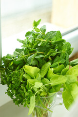 Green organic. Bunch of green vegetables salat or plant in a glass