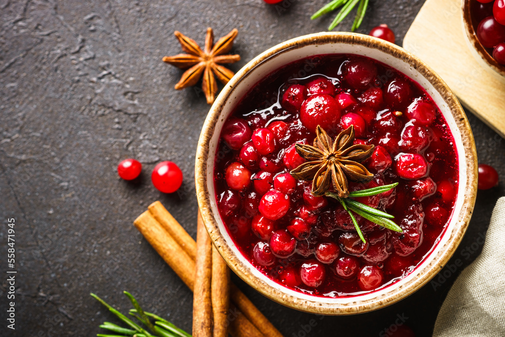 Wall mural Cranberry sauce in a bowl top view.