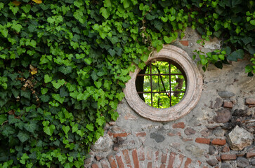Small circular window in a Roman ruin