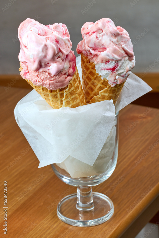 Wall mural ice cream in cones on restaurant table