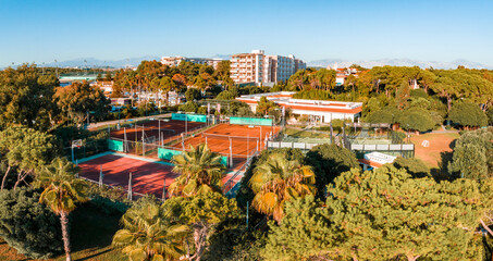 Luxury tropical hotel resort. Outdoor tourism landscape. Luxurious beach resort with swimming pool and beach chairs and palm trees. Summer island relax travel and idyllic vacation