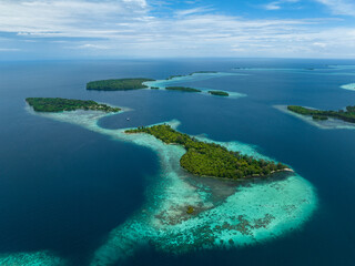 Lush, tropical islands are fringed by robust coral reefs in the Solomon Islands. This beautiful...