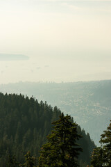 View from the top of Grouse Mountain at the mountain ranges along the Pacific Ranges in the District Municipality of North Vancouver, British Columbia, Canada