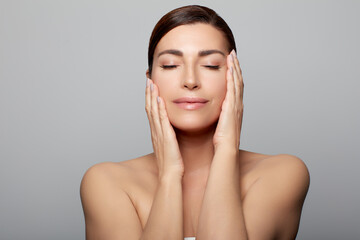 Beautiful middle-aged model in a skincare concep - 558473704