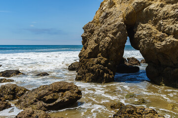 El Matador Beach along the East Pacific Coast Highway in Malibu California. The beach is a collection cliff-foot beaches and bluff top view of the eroding formations, sea stacks, caves and arches. 
