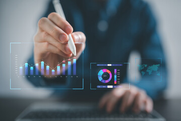 Analyst working with Business data Analytics and Data Management System on computer,Project manager look a report with KPI and metrics connected to database.hand pushing a button on a touch screen