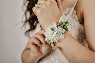 Bride Touching Her Wrist Corsage