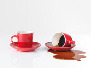 Two coffee cups one spilled