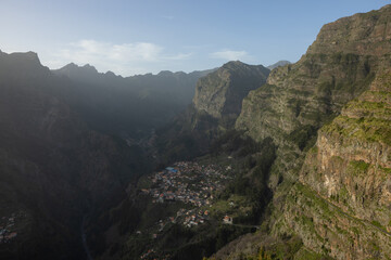 Fototapeta na wymiar A very small village called Curral das Freiras in this canyon in Madeira on a beautiful sunset.