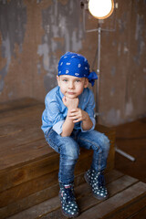 little boy in a bandana