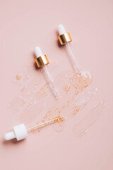 Pipette with cosmetic product, drops and smears, cosmetic texture, serum, cream mask, gel, hyaluron