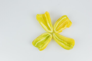 Sliced green sweet pepper isolated on white background. Cutting contour. View from above.