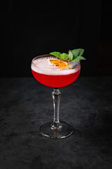 Delicious Spanish food, dishes on a dark background in a restaurant, tasty-looking dishes and drinks, colorful drink with fruit