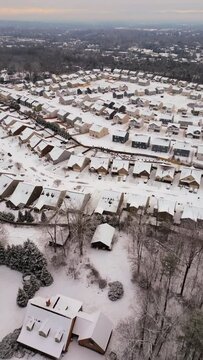 Aerial shot of snow covered small town in Knoxville, Tennessee in the winter. Vertical 9x16 framing.