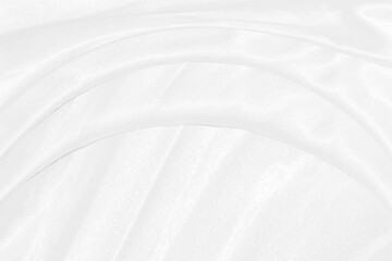 Obraz premium Smooth elegant white silk or satin luxury cloth texture can use as wedding background. Luxurious background design
