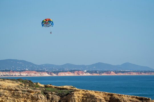 Parachute paragliding blue sky sea