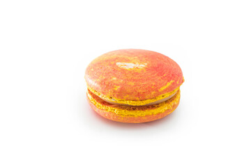 Orange French macaroon isolated on white background. Tasty colorful macaroons. French pastry made from egg whites. Culinary and cooking concept.
