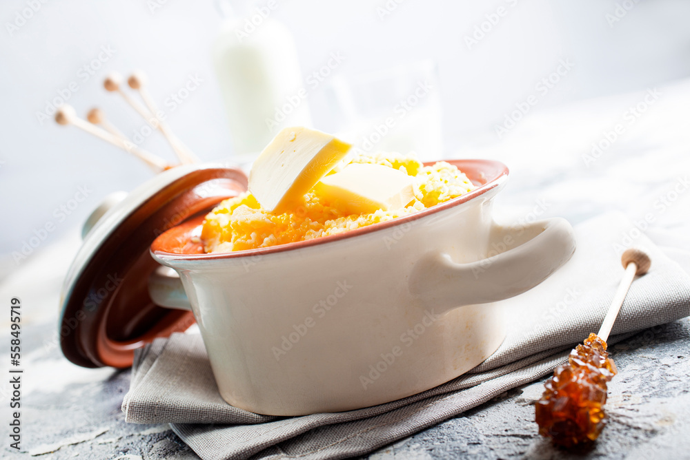 Canvas Prints porridge with butter in plate on rustic table