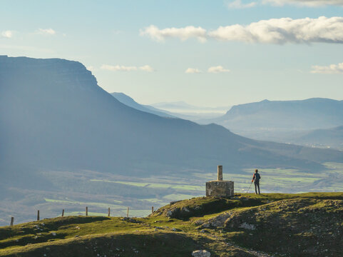 Hiker at the top of Trinidad de Erga. Aizkorbe, Navarre. Beriain and the Sakana