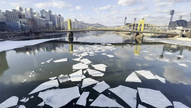 Ice floes on a river through the city