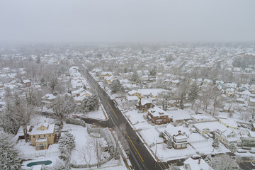 Obraz premium Aerial view of snowfall after severe winter American small town in South Carolina US