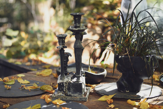 The vintage candles with dripping paraffin in autumn