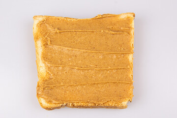 Homemade peanut butter and heart shaped sandwich on white background. The concept of love for food. Favorite breakfast.