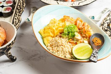 Asian salad dish with shrimp, pork and vegetables. High quality photo