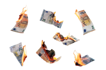 Burning money, collection of twenty and fifty euro paper banknotes with flames isolated, finance concept for inflation, currency and investment risk, selected focus